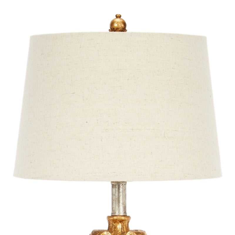 Antique gold and silver table lamp with natural linen shade and finial