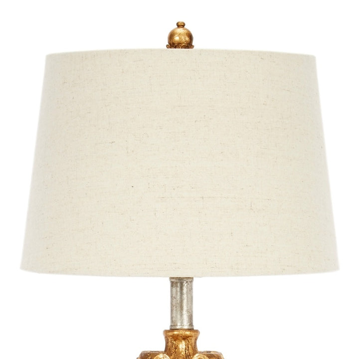 Antique gold and silver table lamp with natural linen shade and finial