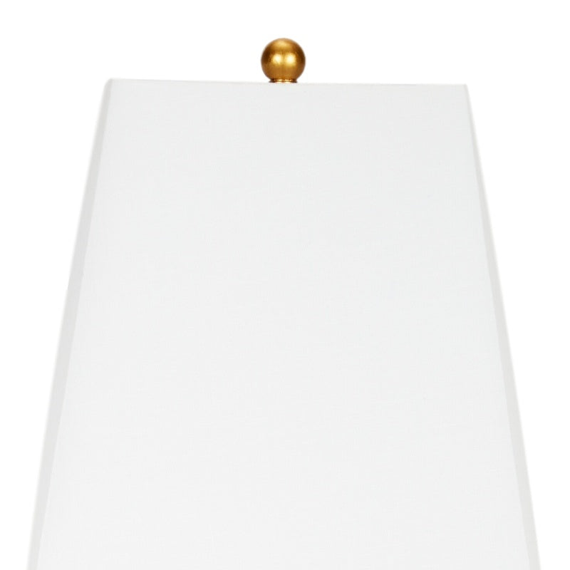 Gold table lamp with white fabric shade and finial
