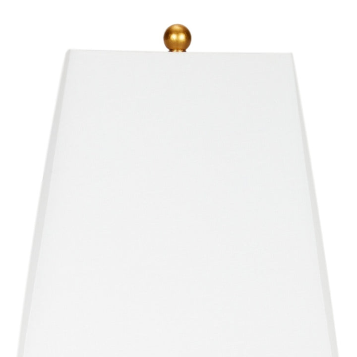 Gold table lamp with white fabric shade and finial