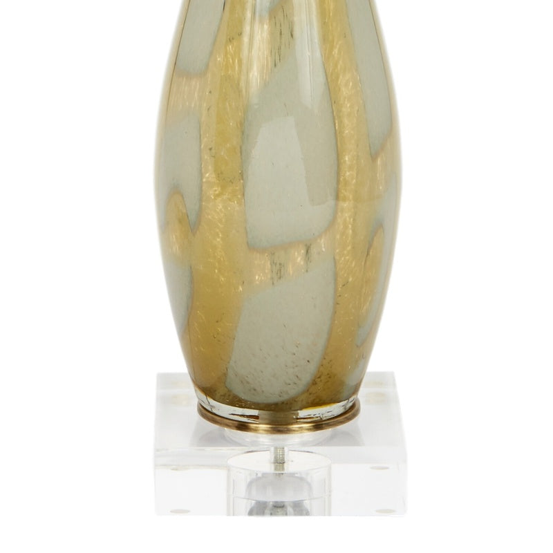 Hand-blown amber glass lamp body with brass trim base ring