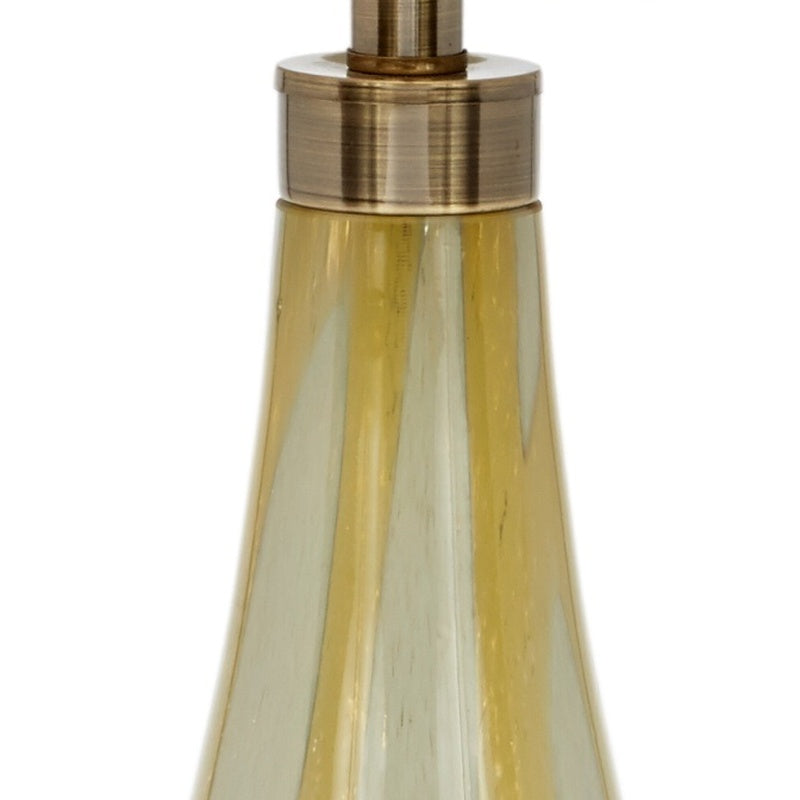 Hand-blown amber glass lamp base with brass top and fabric shade