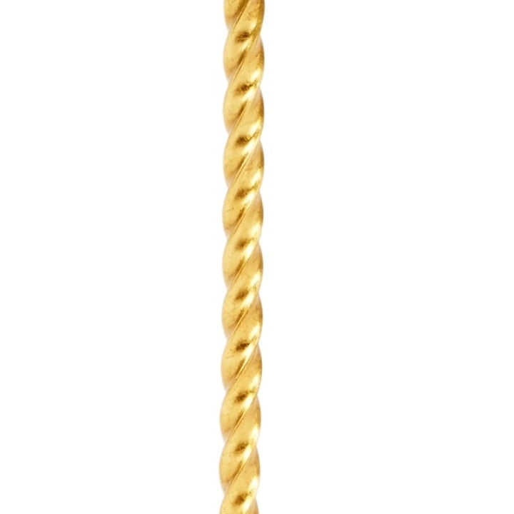 Gold twisted rope lamp stem in close-up, braided spiral texture.