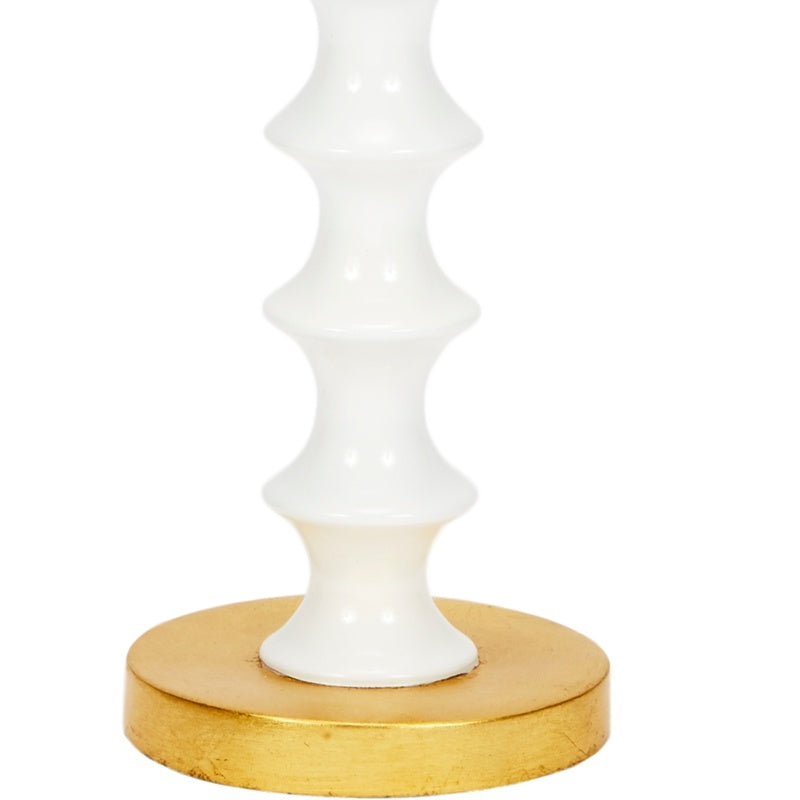 White ceramic table lamp with gold base and gold-topped finial