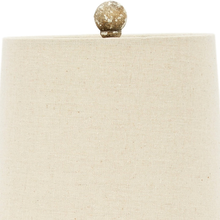 Mini flower lamp with beige fabric shade and gold speckled finial sphere
