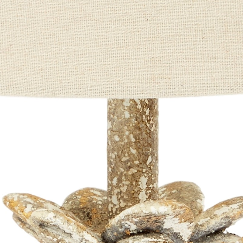 Mini flower lamp close-up: beige shade and gold speckled flower stem