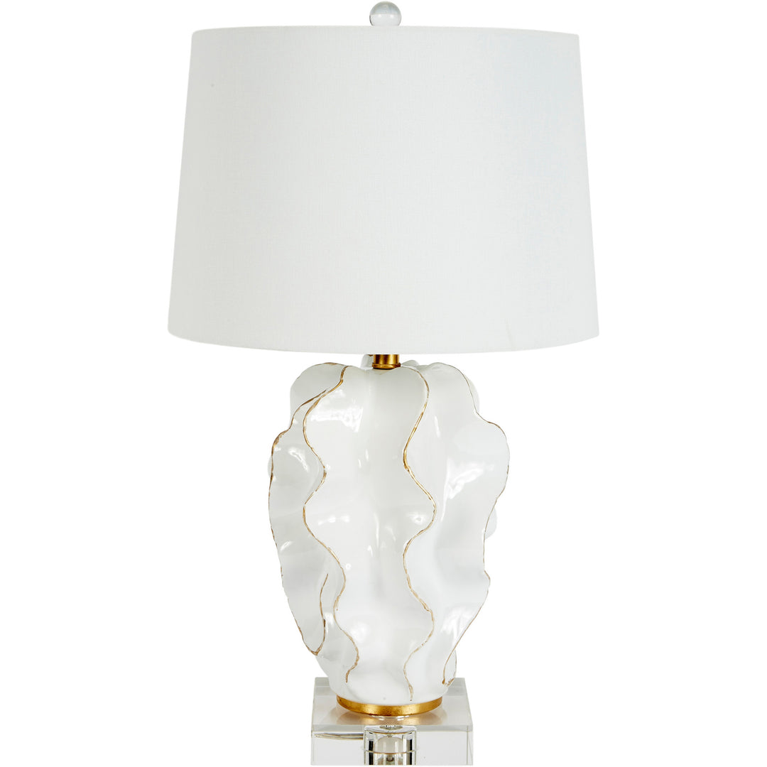Hannah white ceramic table lamp with elegant gold accents and a soft white linen shade, perfect for brightening up any modern living space.
