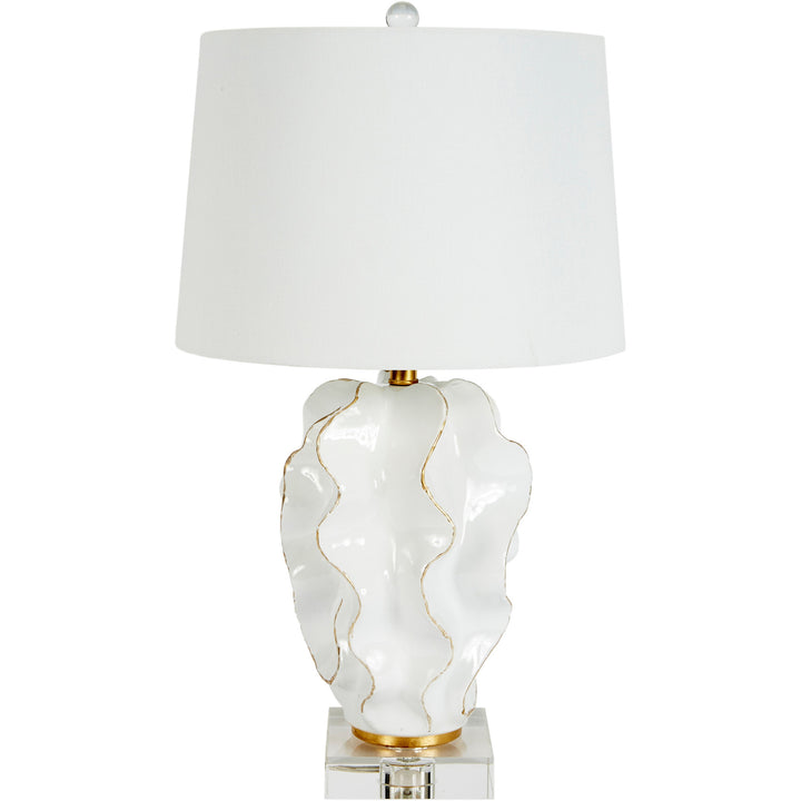 Hannah white ceramic table lamp with elegant gold accents and a soft white linen shade, perfect for brightening up any modern living space.