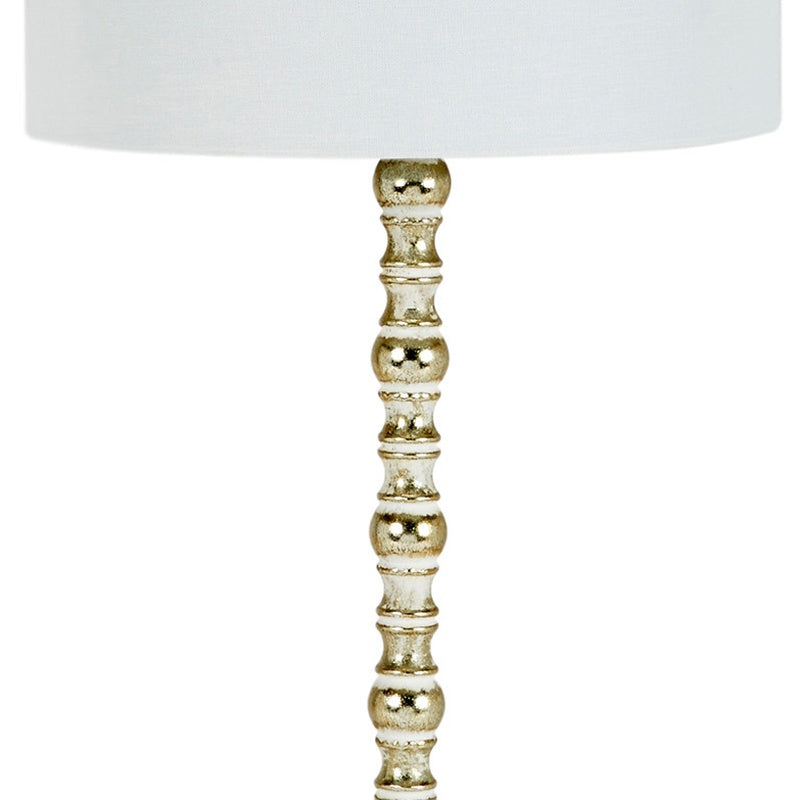 Turned gold lamp pedestal with decorative stacked spheres