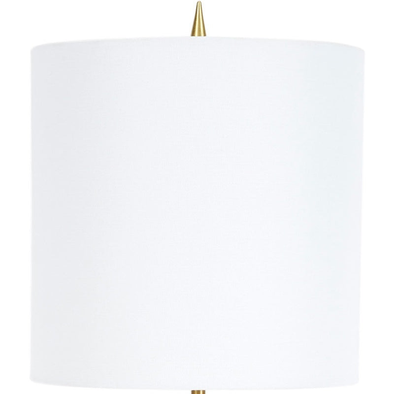 Table lamp with white fabric drum shade and brass stem