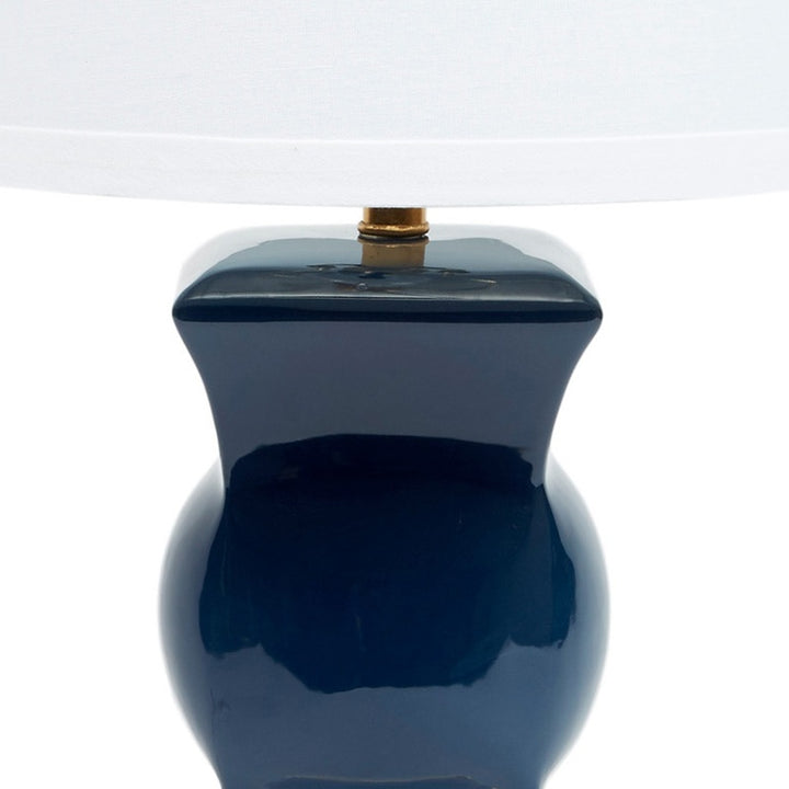 Navy blue ceramic table lamp top with brass socket and finial