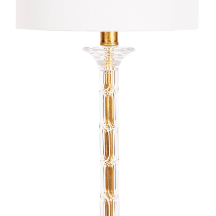 Table lamp base in clear acrylic with gold accents under white shade