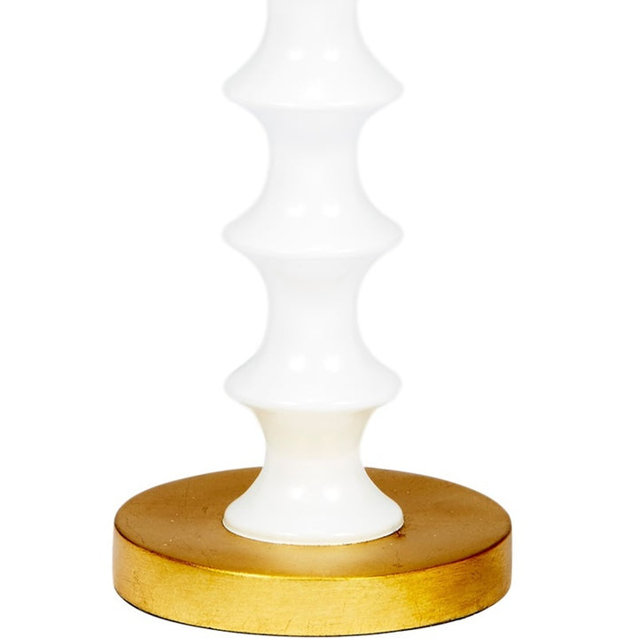 Mint blue and white table lamp with round gold base and fluted ceramic column.