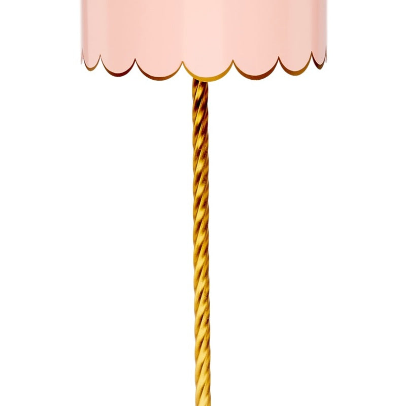Blush lamp shade with twisted gold pole support