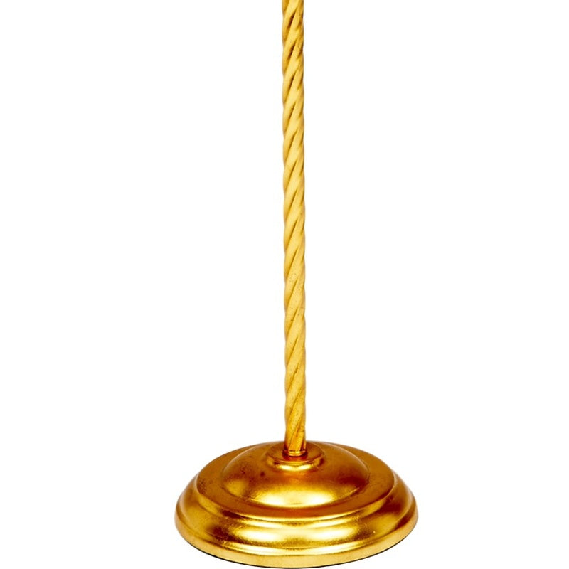 Twisted gold lamp pole with round gold base.