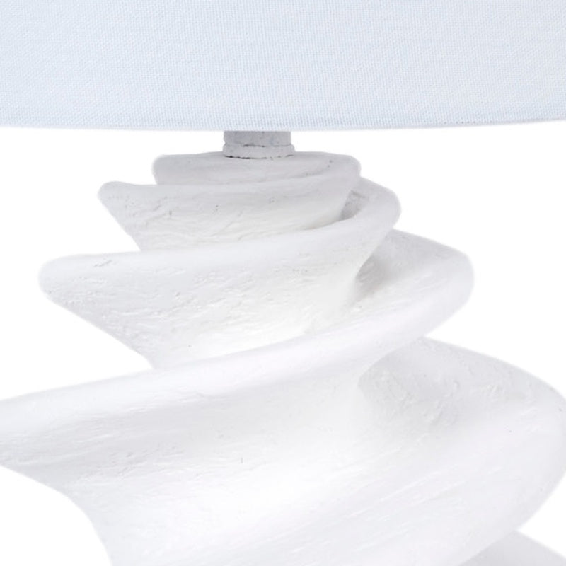 White gesso shell table lamp with linen drum shade and textured spiral pedestal