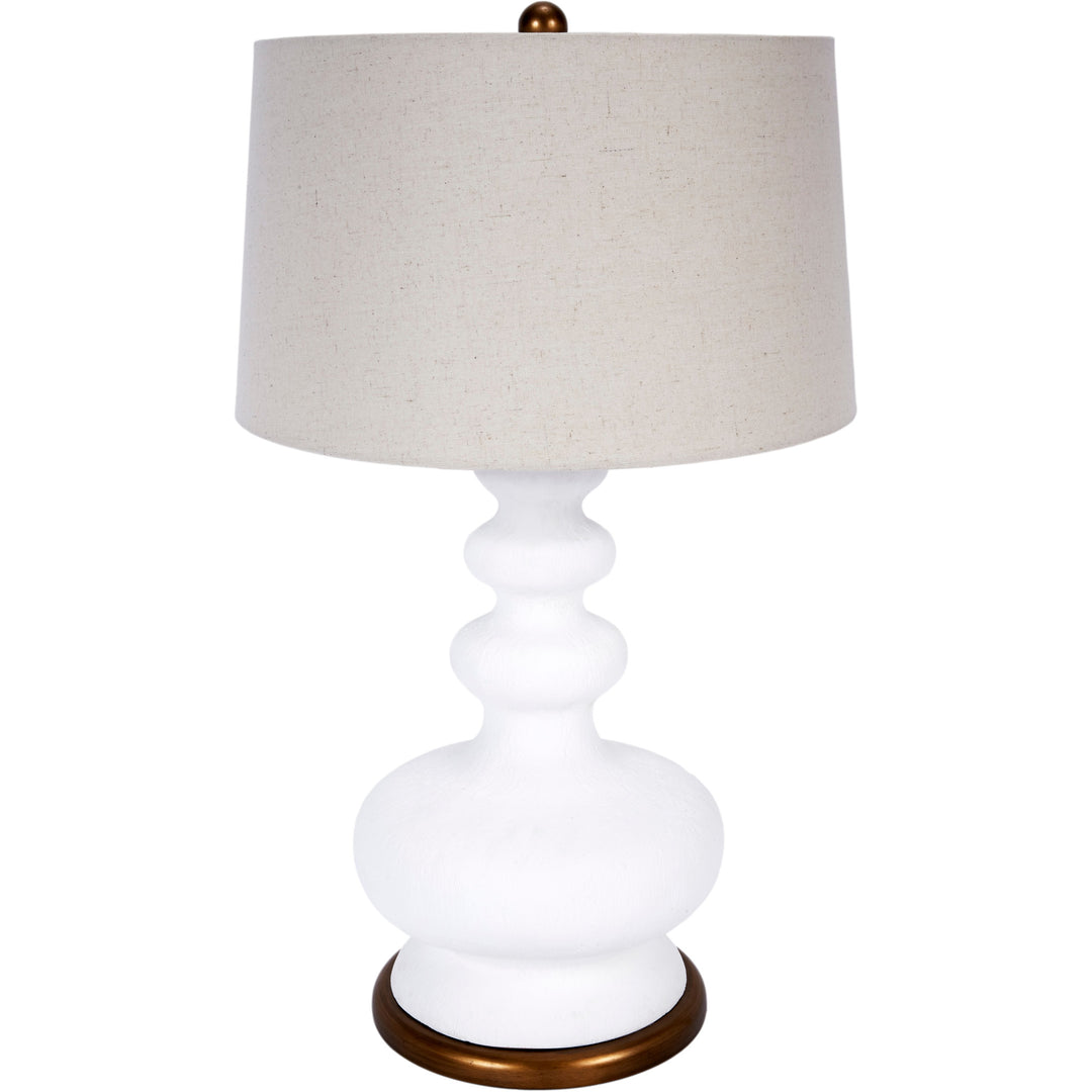 Whitley white gesso table lamp with a sleek brass base, perfect for modern living rooms, bedrooms, or office spaces.