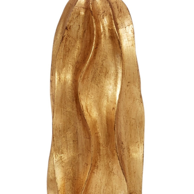 Gold leaf table lamp, detailed view of gold sculpted base texture