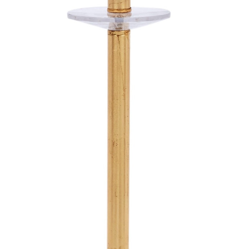 Gold lamp column with clear crystal cap and underside of white drum shade