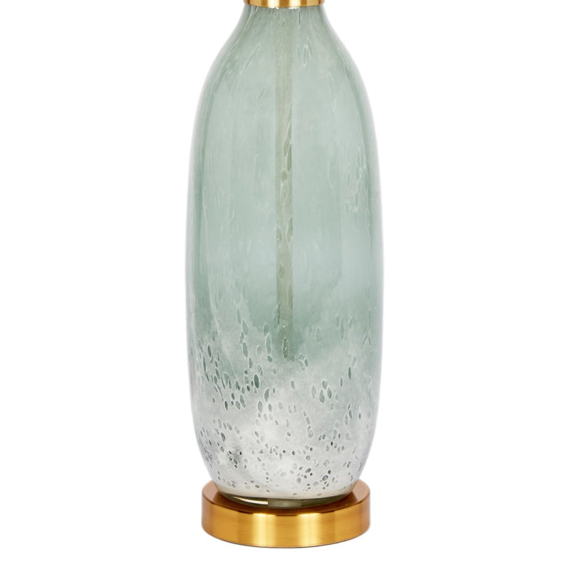 Table lamp with off-white shade, pale green glass base, and gold-tone bottom ring