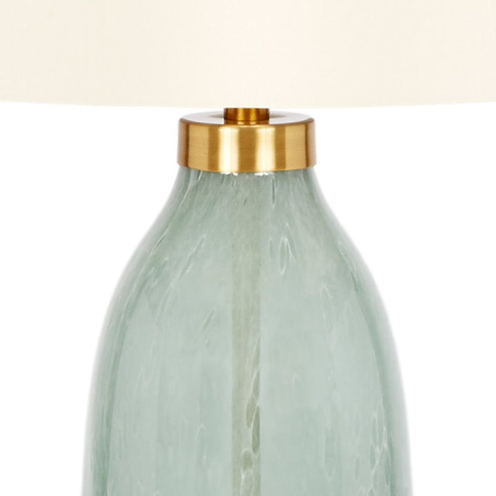 Table lamp neck with gold-tone collar atop pale green handblown glass