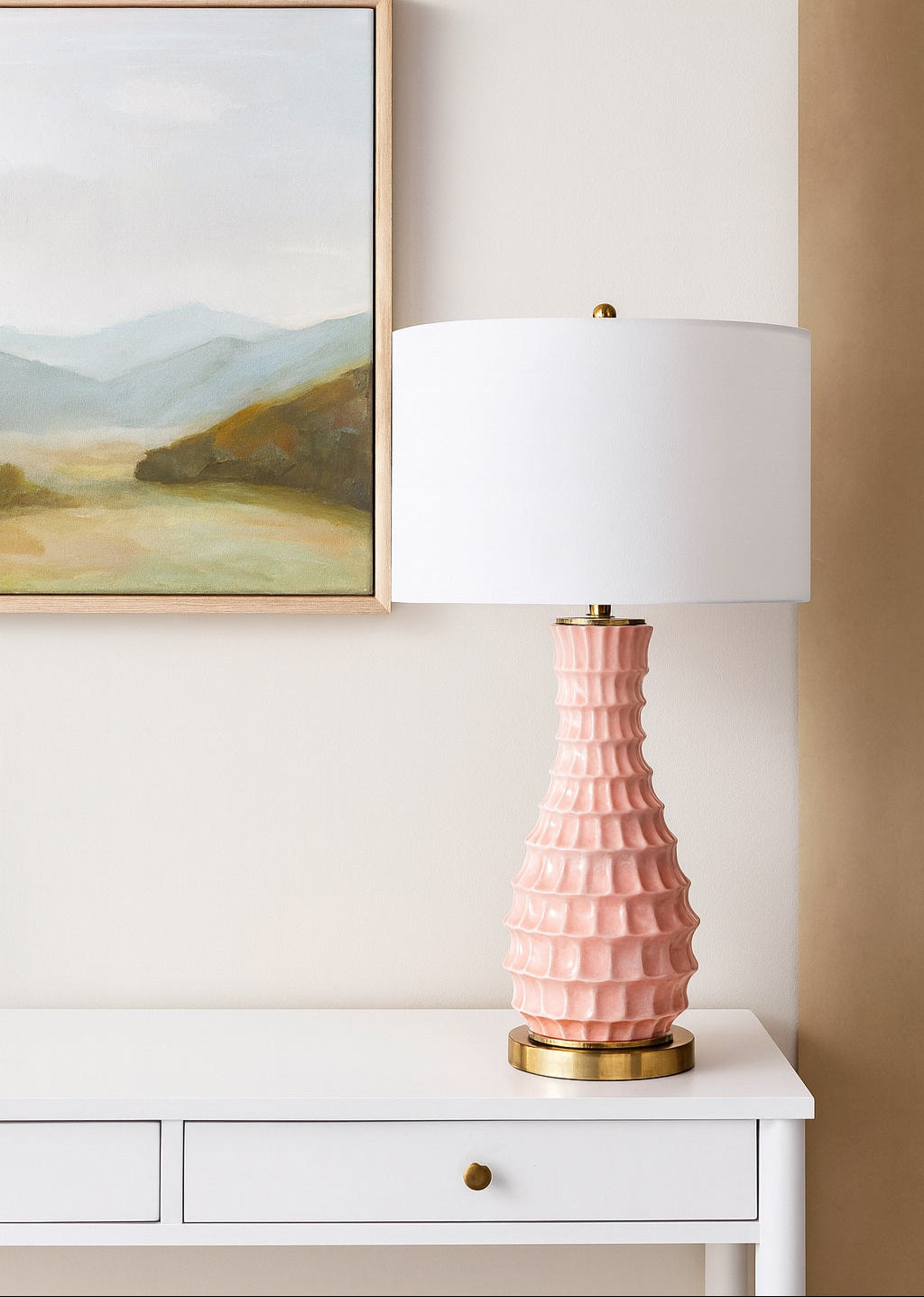Elegant Zara table lamp with a delicate blush ceramic base and linen shade, offering a refined, soft glow that enhances any space with modern sophistication.