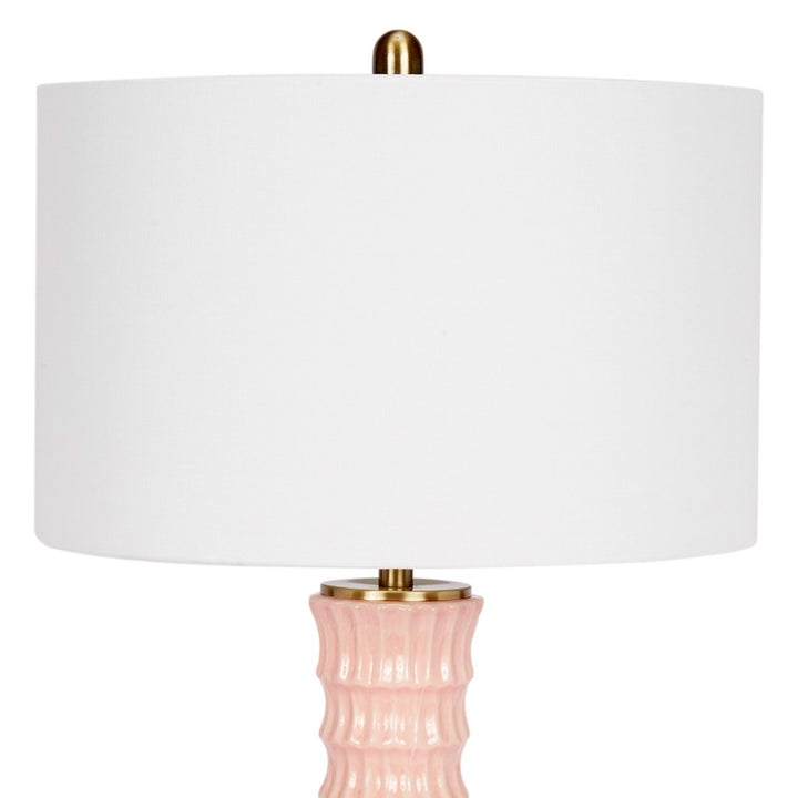 Blush pink ceramic table lamp with white linen drum shade and gold accents