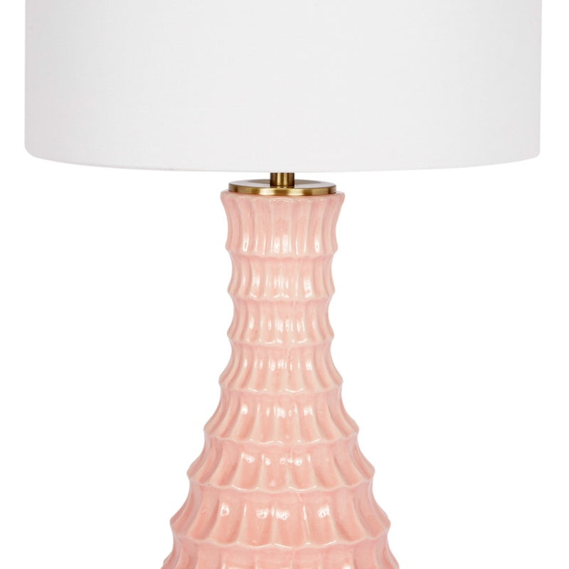 Blush ceramic table lamp with white drum shade and gold neck cap, mid view
