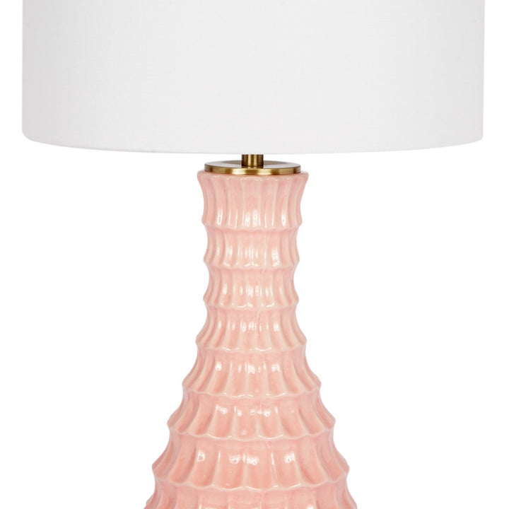 Blush ceramic table lamp with white drum shade and gold neck cap, mid view