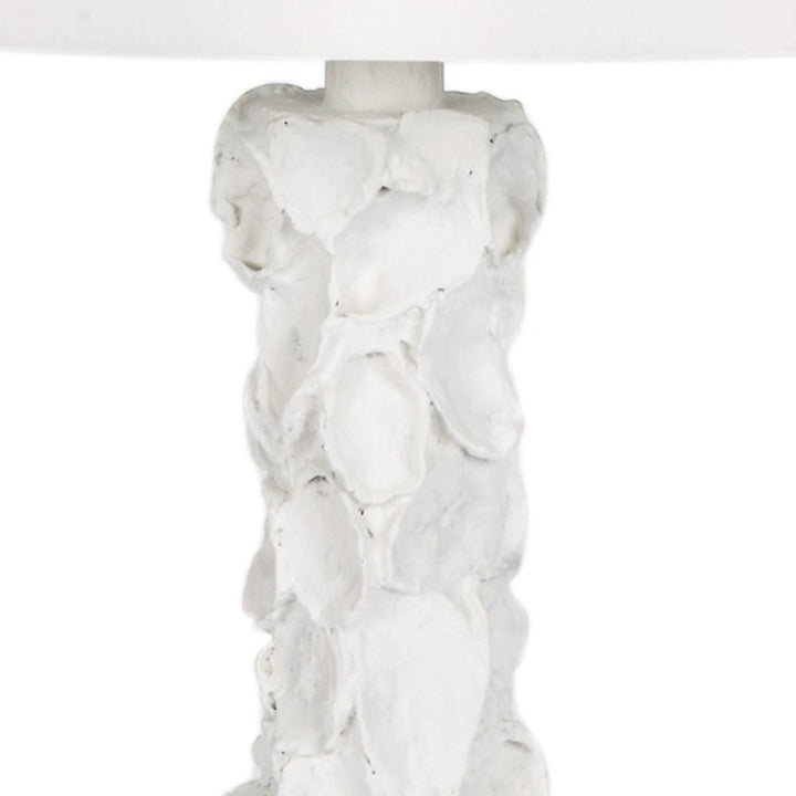 White gesso oyster shell lamp base with textured sculpted detail