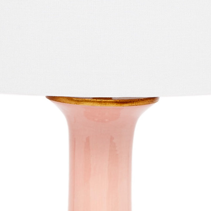 Blush ceramic lamp base with white linen shade and gold rim detail