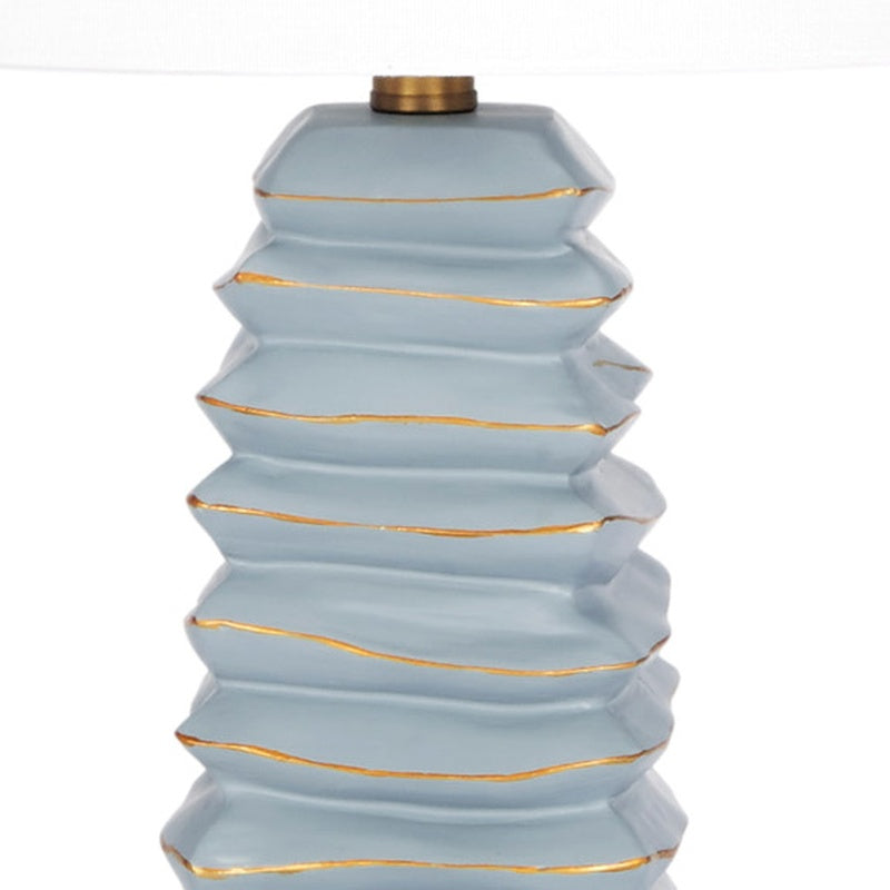 Table lamp neck and stacked soft teal tiers with gold stripe accents