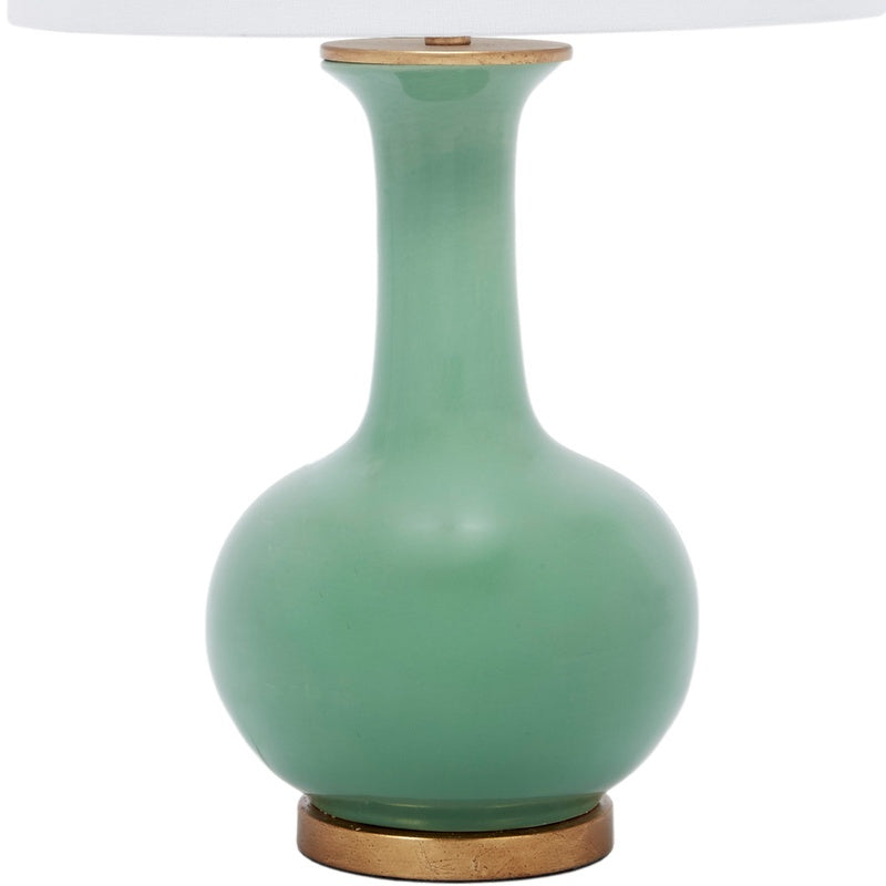 Green ceramic table lamp with white linen shade and round bulb base