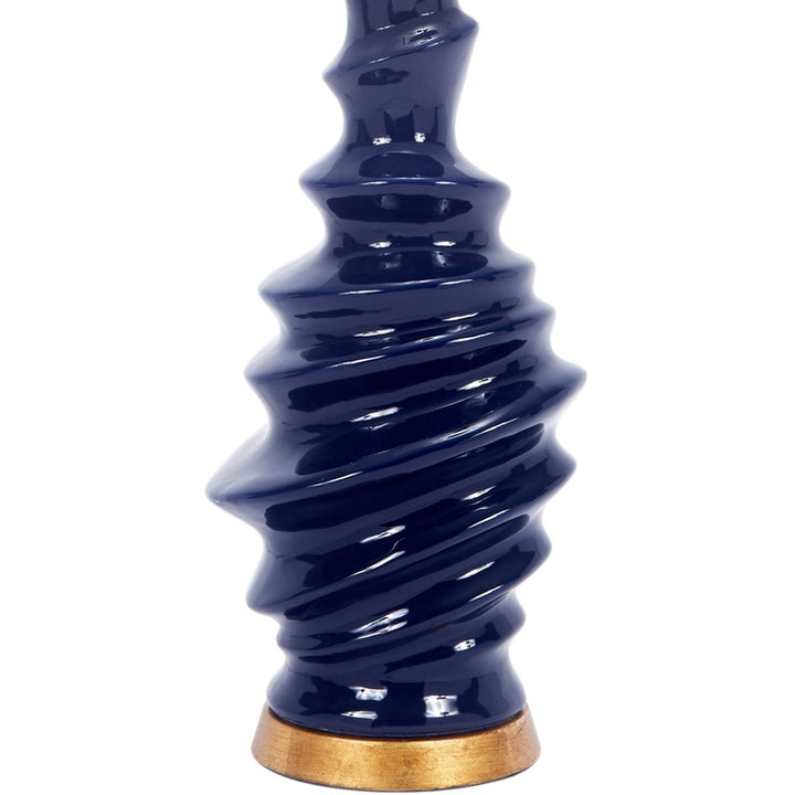 Glossy navy ceramic table lamp base with gold-toned stem and bottom ring