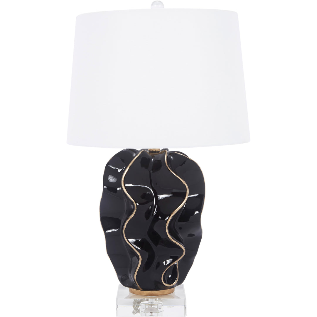 Modern Hannah wave lamp featuring a black ceramic base and gold accents, perfect for adding style and contrast to your living room or bedroom.