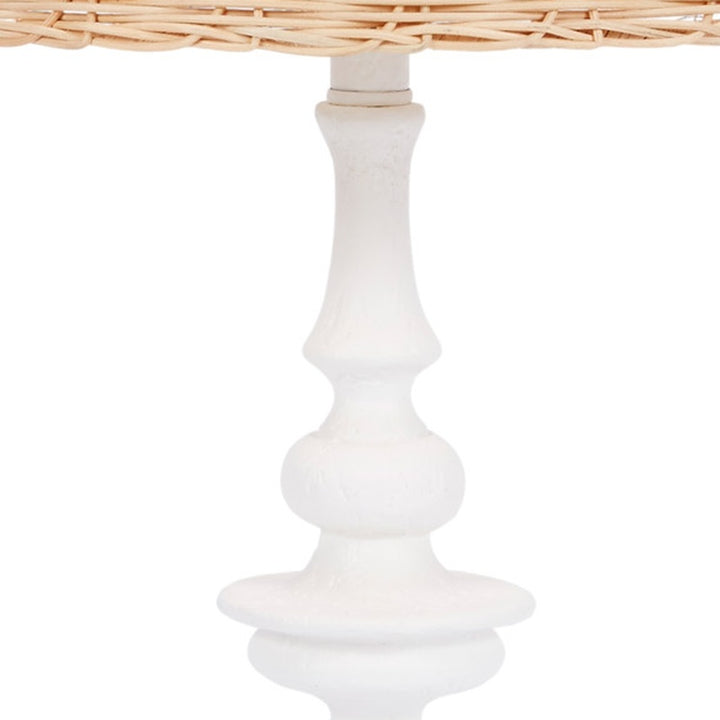 White gesso table lamp base with rattan shade edge
