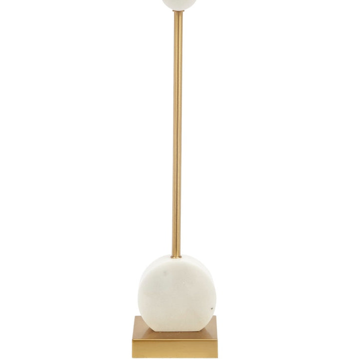 Gold buffet lamp with white drum shade and large white marble disc pedestal base