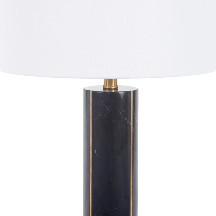 Black marble cylinder table lamp base with brass stem and white fabric drum shade