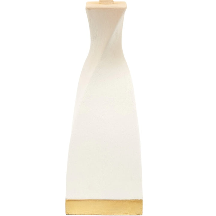 Off-white table lamp base with gold accent top and drum shade