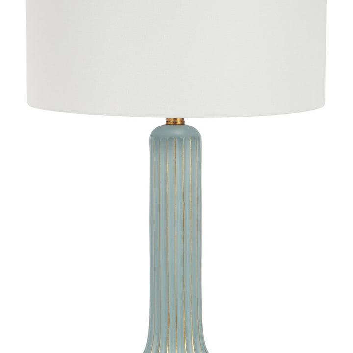 Teal table lamp base with vertical gold-lined ridges and white drum shade