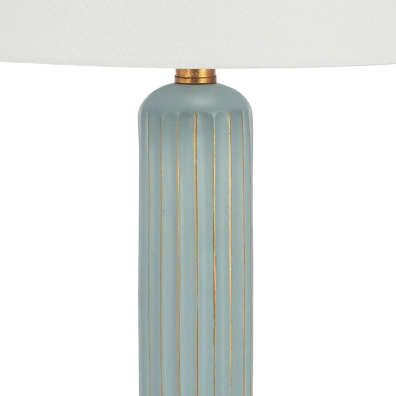 Teal table lamp base with vertical gold lines and brass top cap under white shade