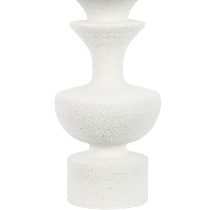 White resin table lamp featuring stacked cylindrical pedestal base with speckled texture
