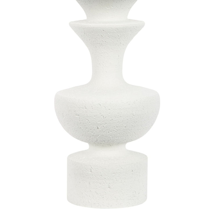 White resin table lamp featuring stacked cylindrical pedestal base with speckled texture