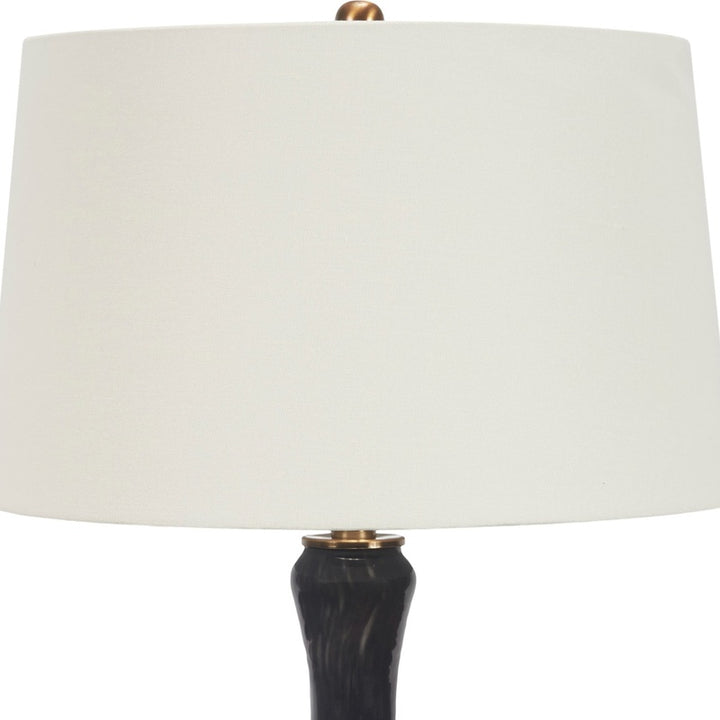Black hand-blown glass lamp with white drum shade and gold-toned hardware