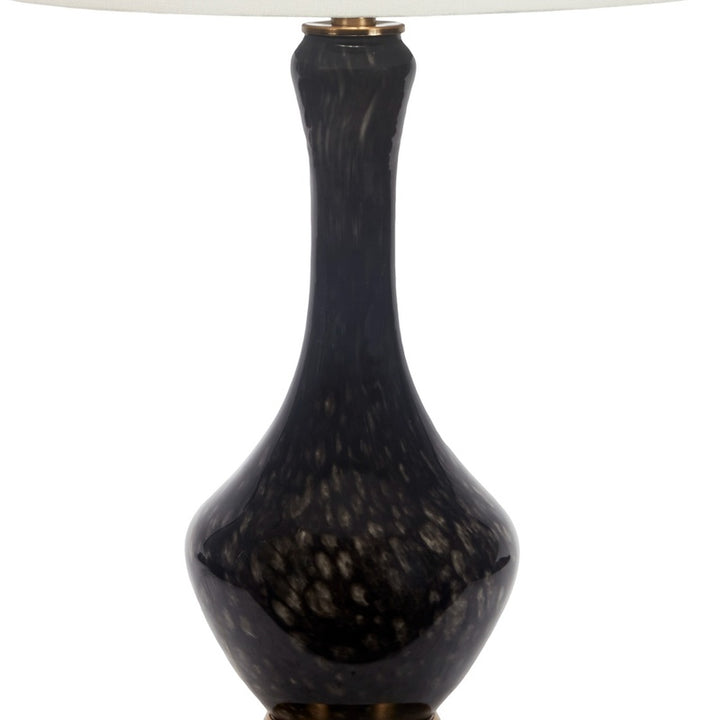 Black hand-blown glass lamp base with gold collar, slender teardrop shape