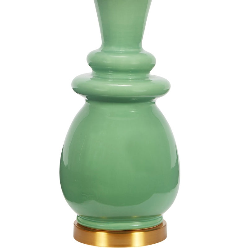 Ceramic table lamp with green ceramic base and white drum shade, brass foot