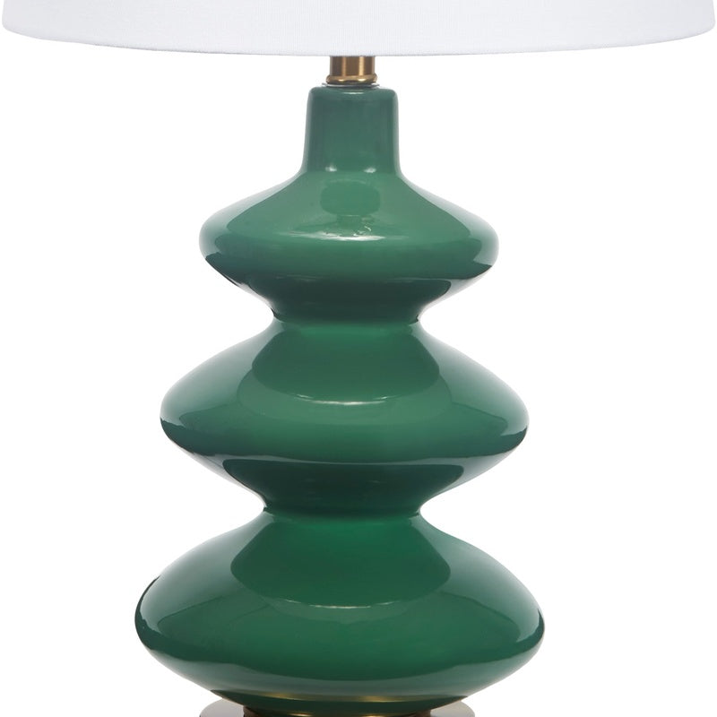 Green glass table lamp base with stacked teardrop shapes and white fabric shade