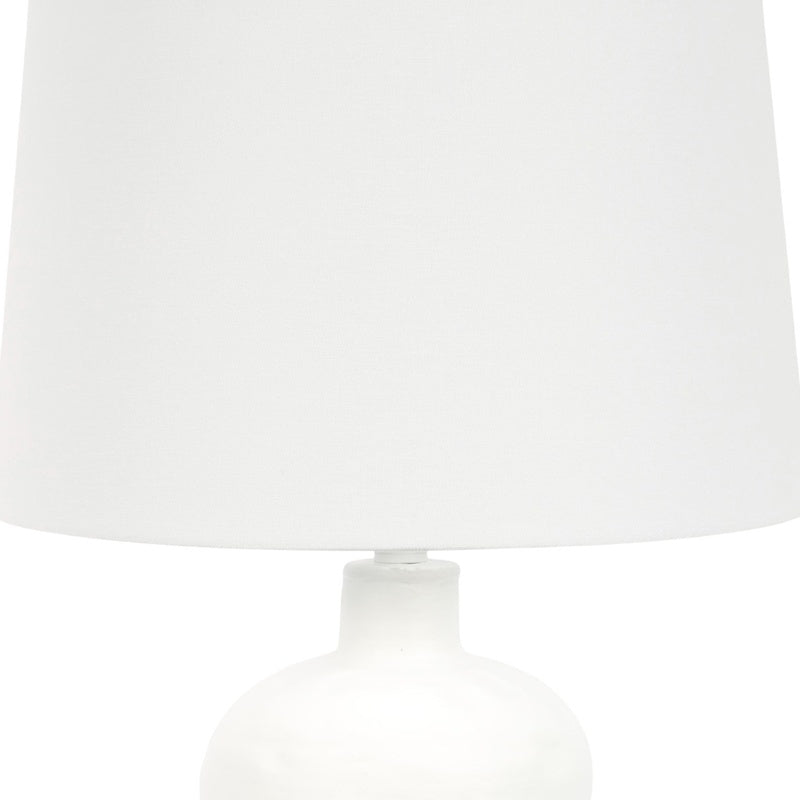 White plaster-textured table lamp, drum shade and neck detail
