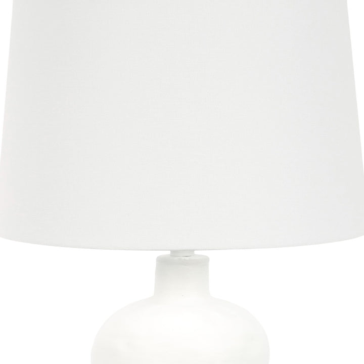 White plaster-textured table lamp, drum shade and neck detail