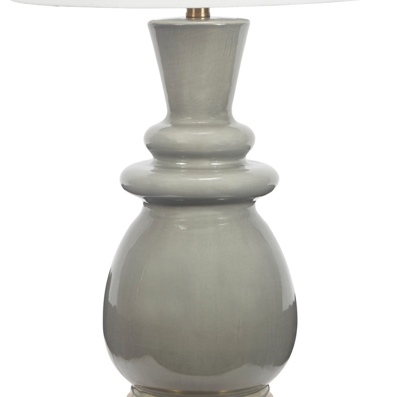 Gray ceramic lamp base with brass socket and white drum shade top